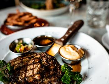 A steak dinner on a nice table