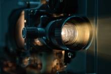up-close view of the lens of a movie camera